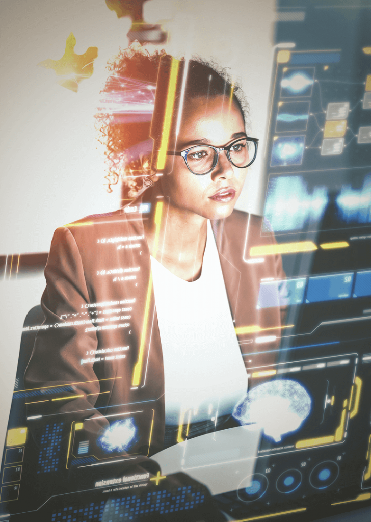 Frau die vor einem Bildschirm sitzt und konzentriert arbeitet